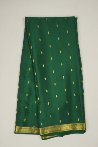 emerald green crepe silk saree with floral zari buttas