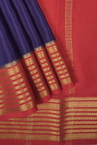 navy blue crepe silk saree with red temple zari border