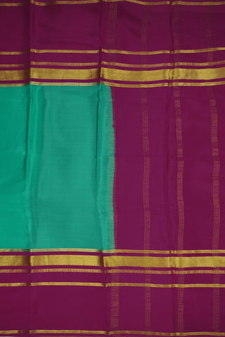 Turquoise blue crepe silk saree with pink pallu