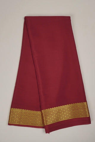 Maroon crepe silk saree with geometric zari border