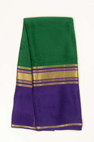 green and purple crepe silk saree with contrast zari border