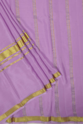 Lilac crepe silk saree with gold zari border