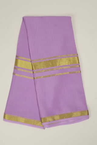 Lilac crepe silk saree with gold zari border