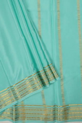 Aqua blue crepe silk saree with tassel border