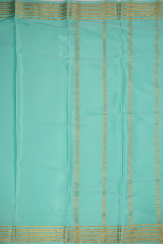 Aqua blue crepe silk saree with tassel border