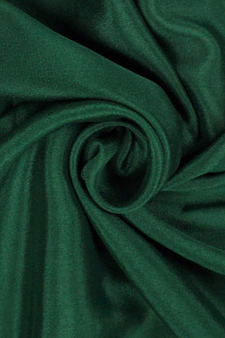 Bottle green crepe silk saree with Tanjore embroidery