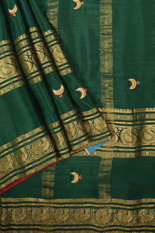 Bottle green crepe silk saree with Tanjore embroidery