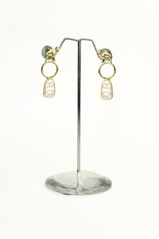 Golden-tone brass drop earrings with a camel motif top and a single pearl drop hanging below
