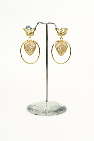 Golden brass drop earrings with a detailed butterfly stud top and a slim hoop holding a teardrop stone