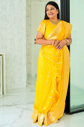 Dolly Jain & Shreya Ghoshal's Yellow Banarasi Organza Saree