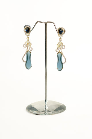 Long drop earrings with brilliant diamond replica stones and deep blue oval and teardrop centre stones