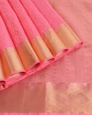 Soft pink handwoven pure silk saree with oval matrix pattern and gold zari striped pallu