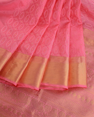 Soft pink handwoven pure silk saree with oval matrix pattern and gold zari striped pallu