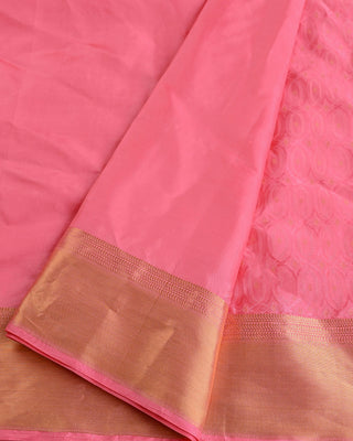 Soft pink handwoven pure silk saree with oval matrix pattern and gold zari striped pallu