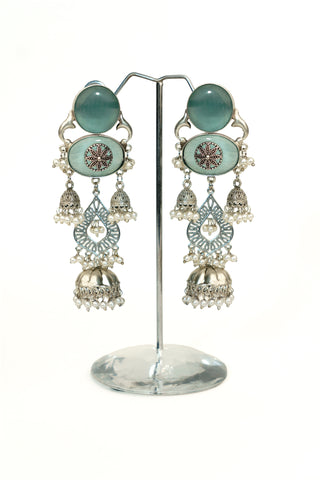 Multi-tier oxidised jhumka earrings with sea green oval stones, floral medallion, filigree tiers and pearl drops