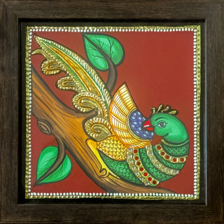 Handcrafted Tanjore painting of peacock on branch with gold leaf	