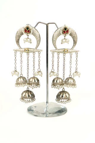 Crescent chandbali oxidised silver replica earrings with pink and green stones, pearl clusters and chain strands
