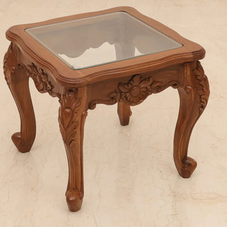 Antique glass side table with carved teakwood base and cabriole legs