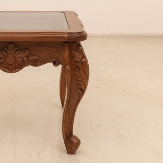 Antique glass side table with carved teakwood base and cabriole legs