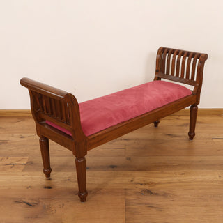 Red velvet rolled-arm bench with slatted teakwood arms and turned legs
