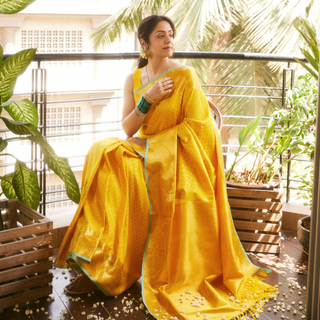 Jyotika's Yellow Kanjivaram Silk Saree with Self Weave Motifs and Green Trim Elegant Bridal Saree