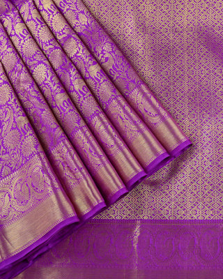 Royal purple pure silk handwoven Kanjivaram saree with gold zari vanasingaram forest motif deer peacock vines and diamond pallu