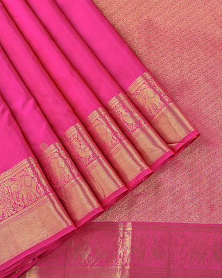 Dual-tone rani pink and red silk Kanjivaram saree with peacock and elephant motifs