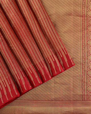 Crimson red Kanjivaram silk saree with gold zari stripes and brocade pallu