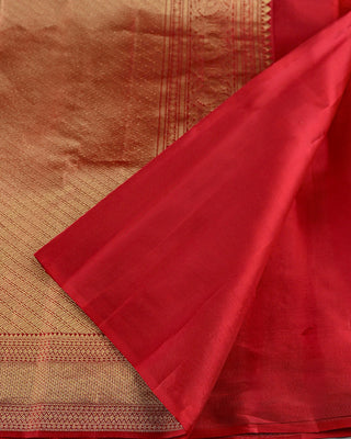 Crimson red Kanjivaram silk saree with gold zari stripes and brocade pallu