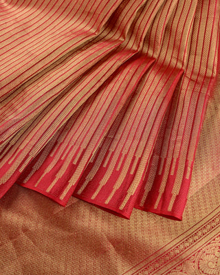 Crimson red Kanjivaram silk saree with gold zari stripes and brocade pallu