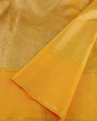 Golden mustard Kanjivaram silk saree with fine zari stripes and brocade pallu