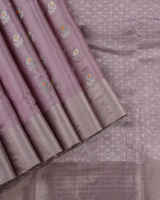 Pastel lavender tissue Chanderi silk saree with silver zari floral buttas orange meenakari and trellis pallu