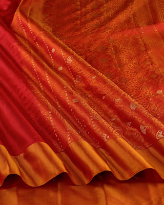 Bright crimson red soft silk saree with contrast orange border and golden zari pallu