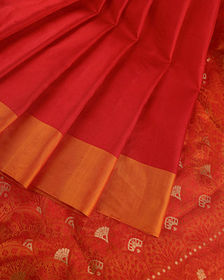 Bright crimson red soft silk saree with contrast orange border and golden zari pallu