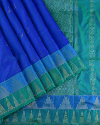 Peacock blue soft silk saree with contrast aqua green korvai temple border