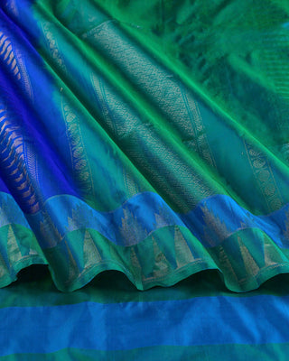 Peacock blue soft silk saree with contrast aqua green korvai temple border