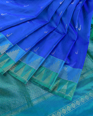 Peacock blue soft silk saree with contrast aqua green korvai temple border