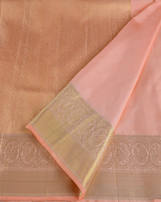 Pastel peach pink Kanjivaram silk saree with deer and peacock zari motifs