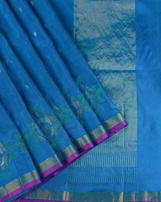 Ocean blue Uppada silk Jamdani saree with silver zari floral motifs circular rose border and magenta pink edge