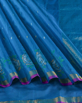 Ocean blue Uppada silk Jamdani saree with silver zari floral motifs circular rose border and magenta pink edge