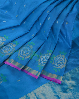 Ocean blue Uppada silk Jamdani saree with silver zari floral motifs circular rose border and magenta pink edge