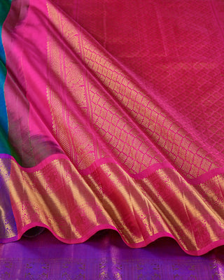 Teal green and blue dual-tone Kanjivaram saree with purple peacock border