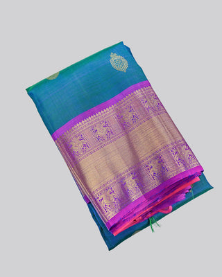 Teal green and blue dual-tone Kanjivaram saree with purple peacock border