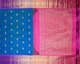 Teal green and blue dual-tone Kanjivaram saree with purple peacock border