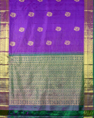 Purple Kanjivaram silk saree with gold zari stripes and green brocade pallu