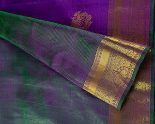Purple Kanjivaram silk saree with gold zari stripes and green brocade pallu