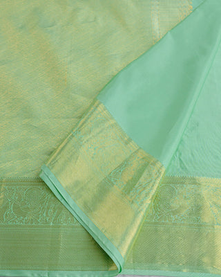 Mint green Kanjivaram tissue silk saree with Gandaberunda bird zari motifs