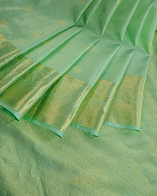 Mint green Kanjivaram tissue silk saree with Gandaberunda bird zari motifs