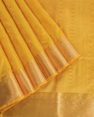 Golden yellow soft silk saree with gold zari oval motifs and peacock pallu design