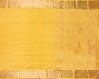 Golden yellow soft silk saree with gold zari oval motifs and peacock pallu design